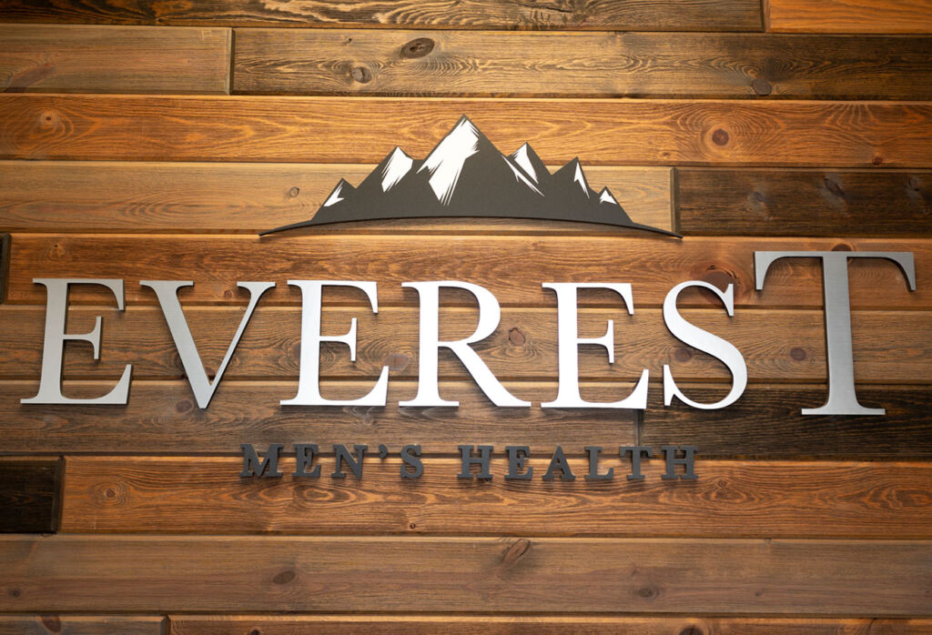 The EveresT logo on a wooden background